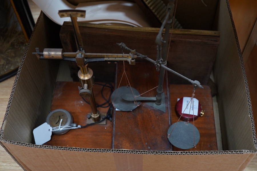 Seven scientific instruments, comprising; a Bimetallic Thermograph Mk III, by Hezzanith; a Victorian mahogany and brass pill roller, reversible, with 24 or 30 grooves; a set of late 19th brass beam scales, the mahogany b